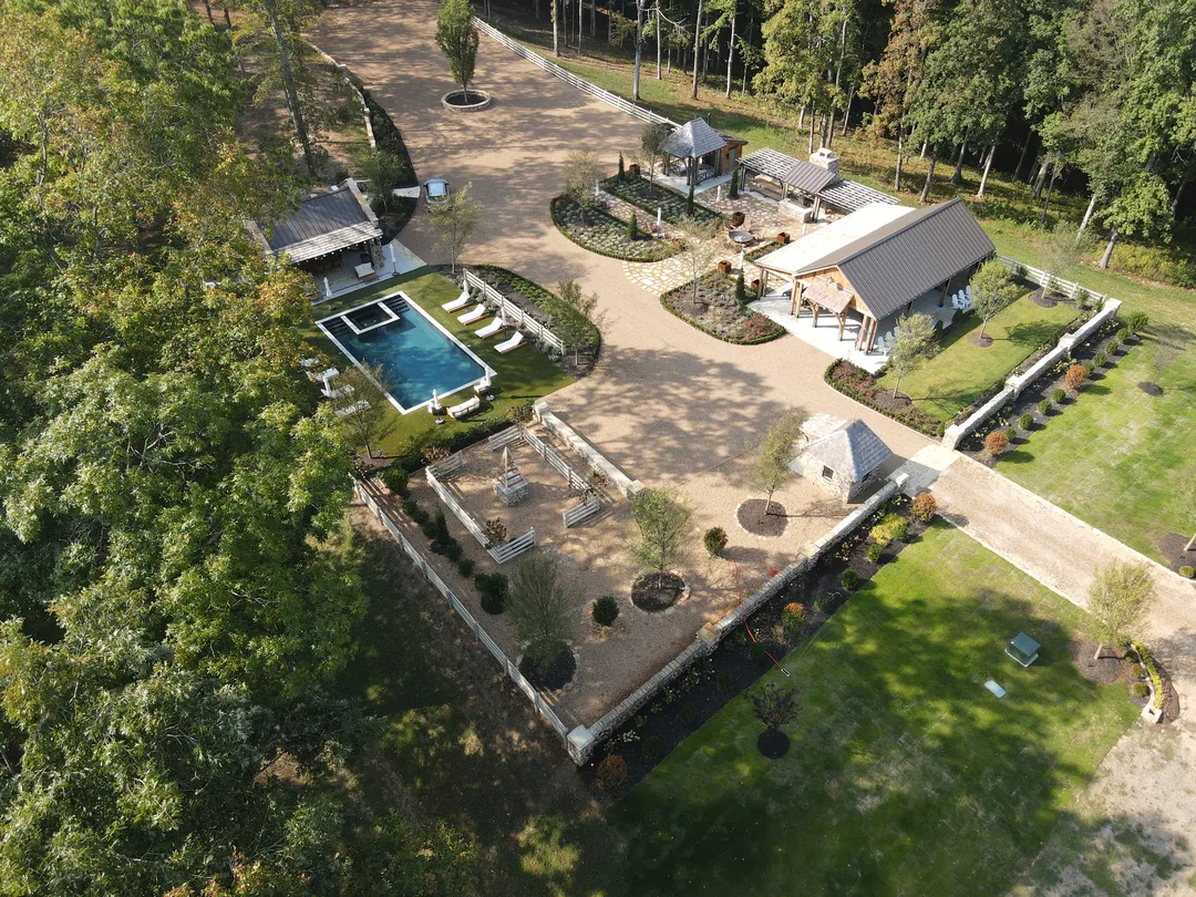 Aerial view of a finished estate landscape with pool