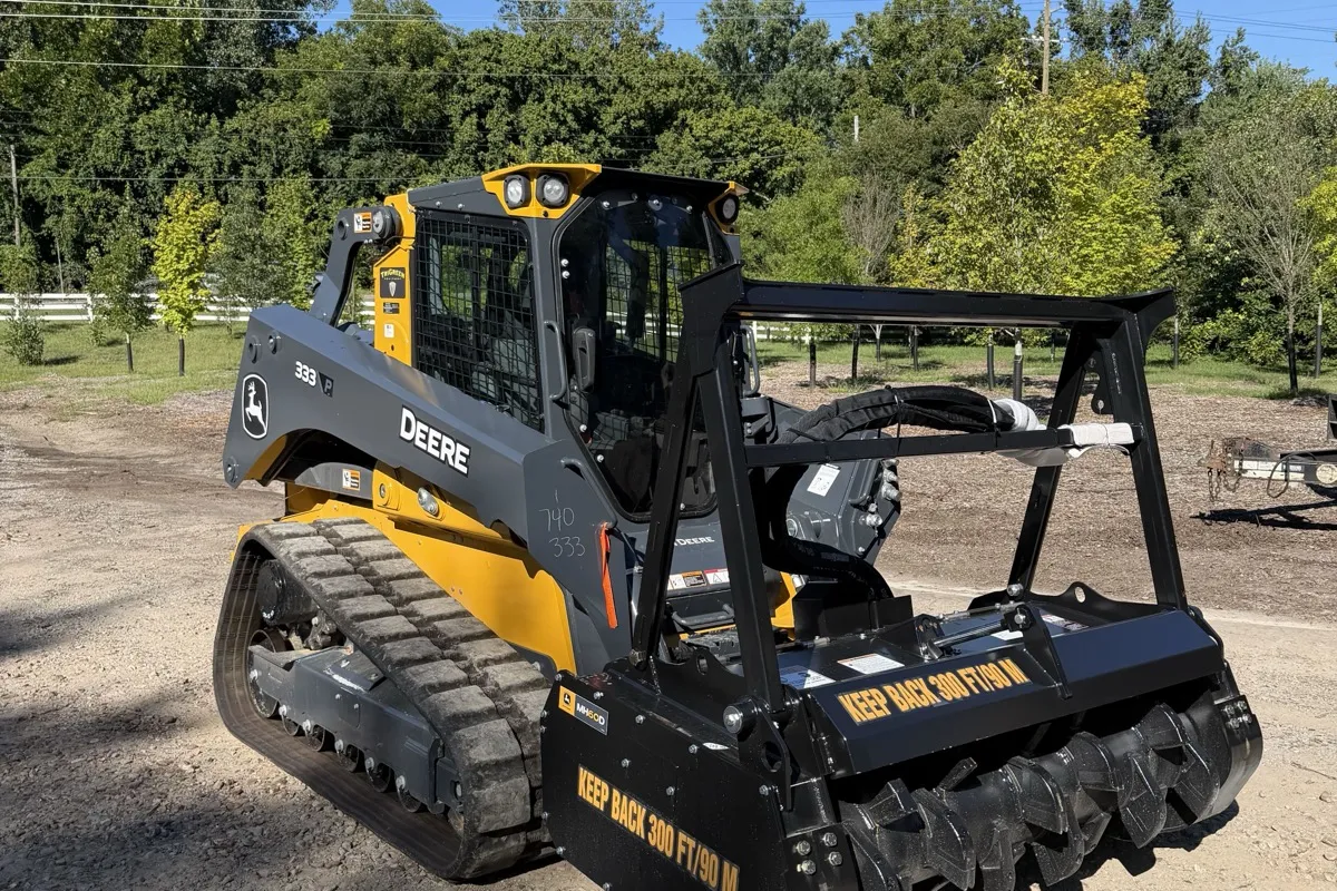 John Deere 333 compact track loader with a forestry mulching head