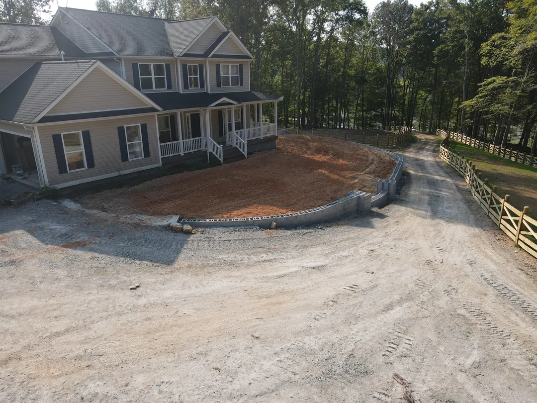 New homesite with finished rough grade around the foundation